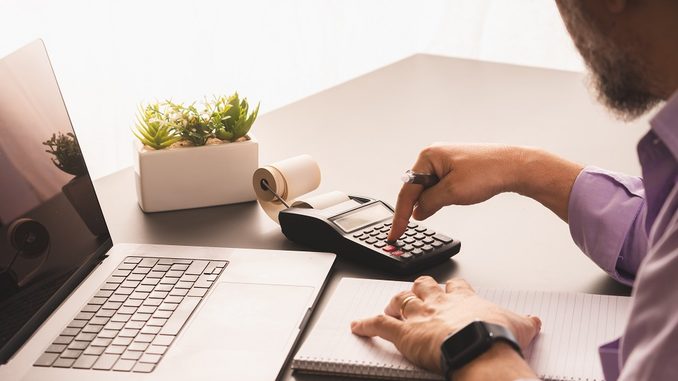 Verifactu-mature-man-working-from-home-office-on-finances-2026-03-20-01-04-47-utc